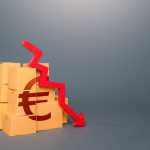 Boxes with euro symbol and down arrow. Decrease in stocks of products. Worsening trade. Embargo, sanctions. Low consumption. Economic slowdown. Price reduction. The fall in the production of goods.
