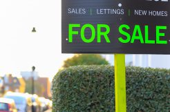 hackney estate agents - For Sale sign displayed on London street in the UK